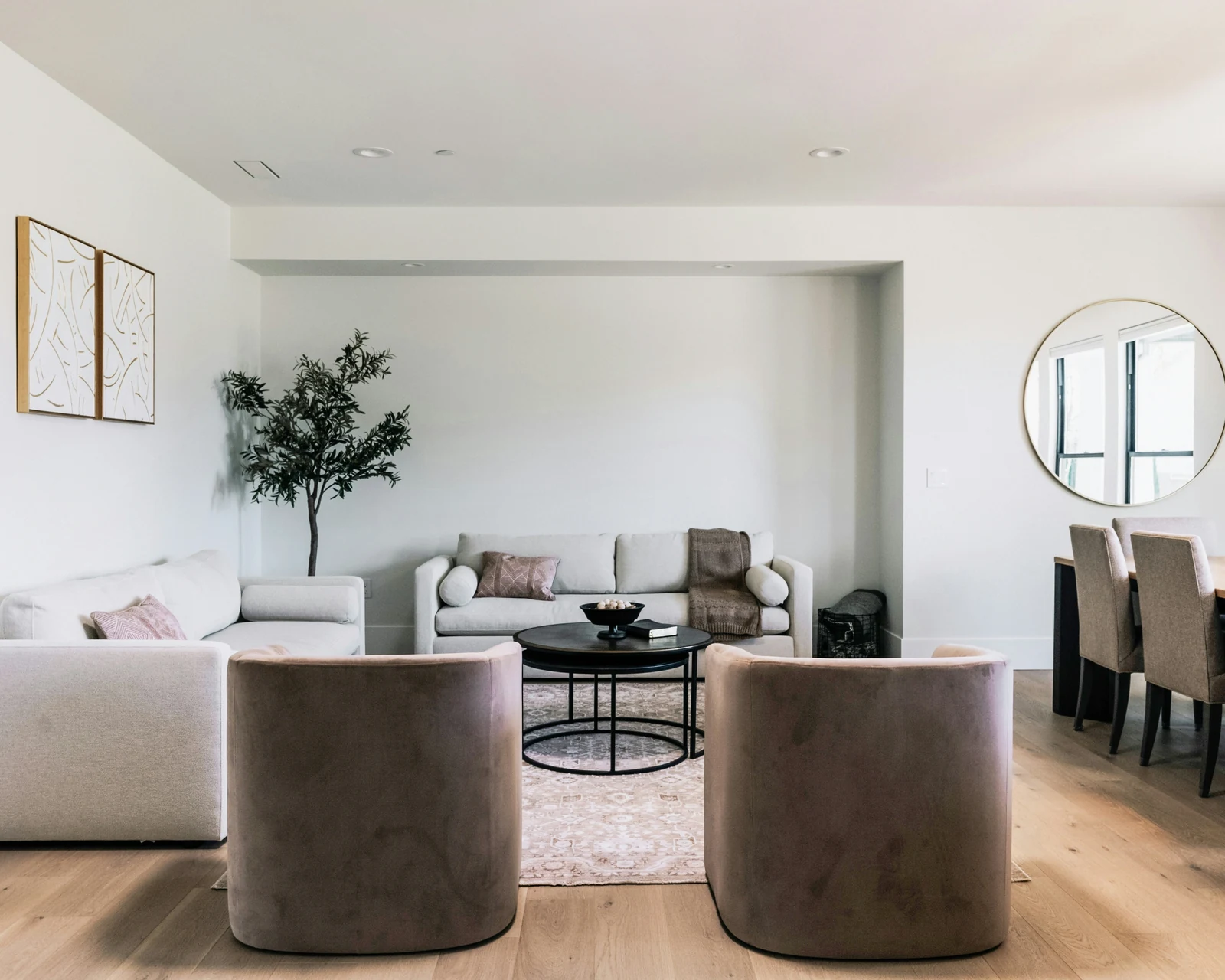 Reference photo of a calm living room with a pale sofa and curved chair
